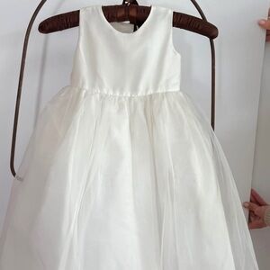 Us Angels Classic Ivory flower girl bridal dress. Wedding season.